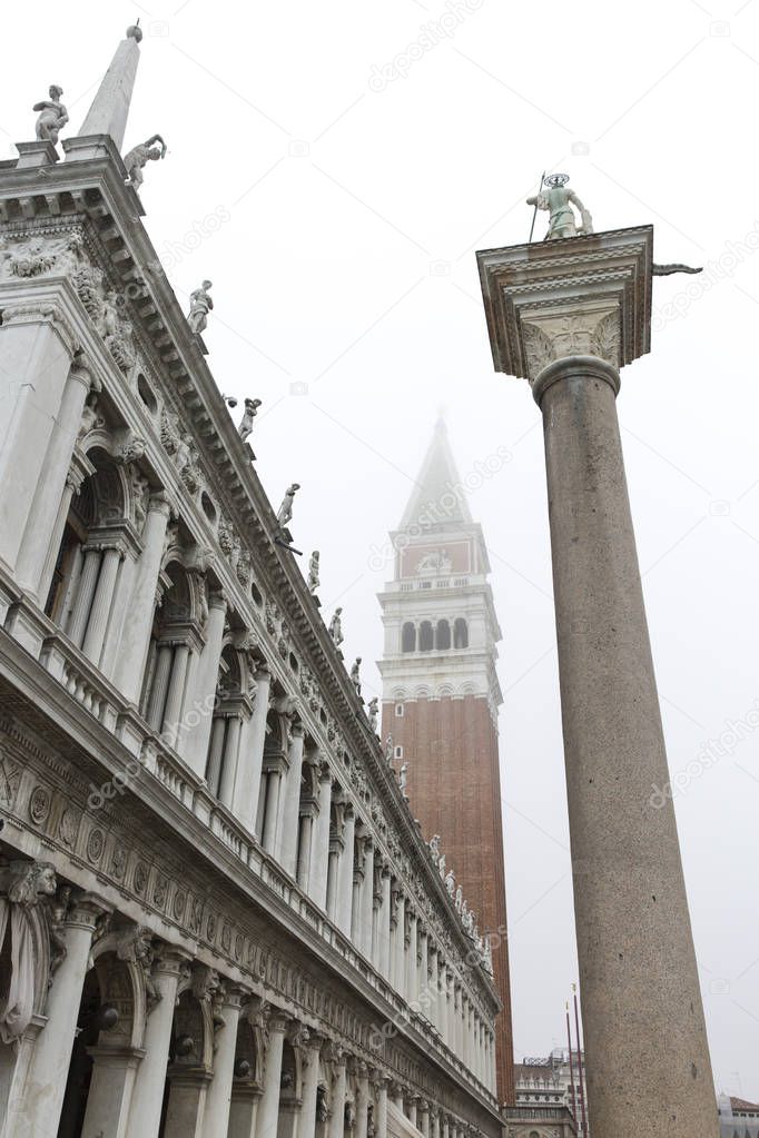 Magical and mysterious view on the Campanile of San Marco Piazza - Saint Mark square - in the mist , Venice, Italy
