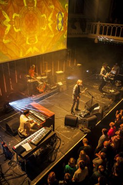 Amsterdam, The Netherlands - 21 february, 2016: concert of English psychedelic rock band Kula Shaker for their album release K 2.0 at Paradiso concert hall clipart