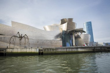 Bilbao, Spain - January 30, 2016: view of modern and contemporary art Guggenheim Museum, designed by American architect Frank Gehry and inaugurated in October 1997. clipart