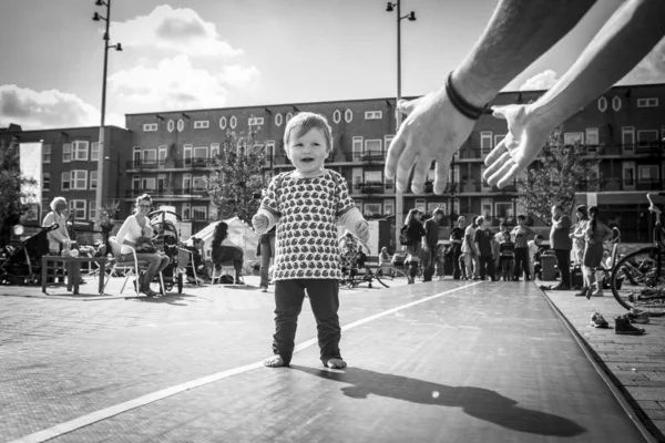 Amsterdam, The Netherlands, 14 September 2014, at West'ival, a free open air Cinema and culture festival on Mercatorplein. children acrobatic and circus workshop