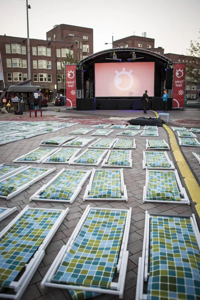 Amsterdam, The Netherlands, 12-14 September 2014, during West'ival, an open air free Cinema and culture festival on Mercatorplein. before the screening, preparation, people hanging aroung and children playing