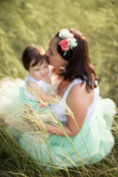 Mother Kisses Hugs Child Soft Focus Blur Several Spikelets Foreground — Stock Photo, Image