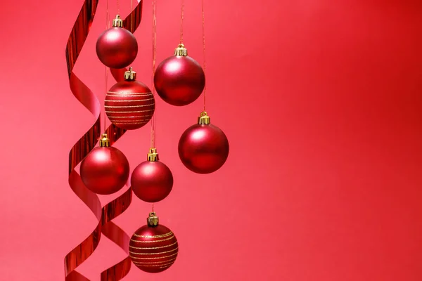 Hanging Christmas Balls Ribbons New Year Composition Red Background — Stock Photo, Image