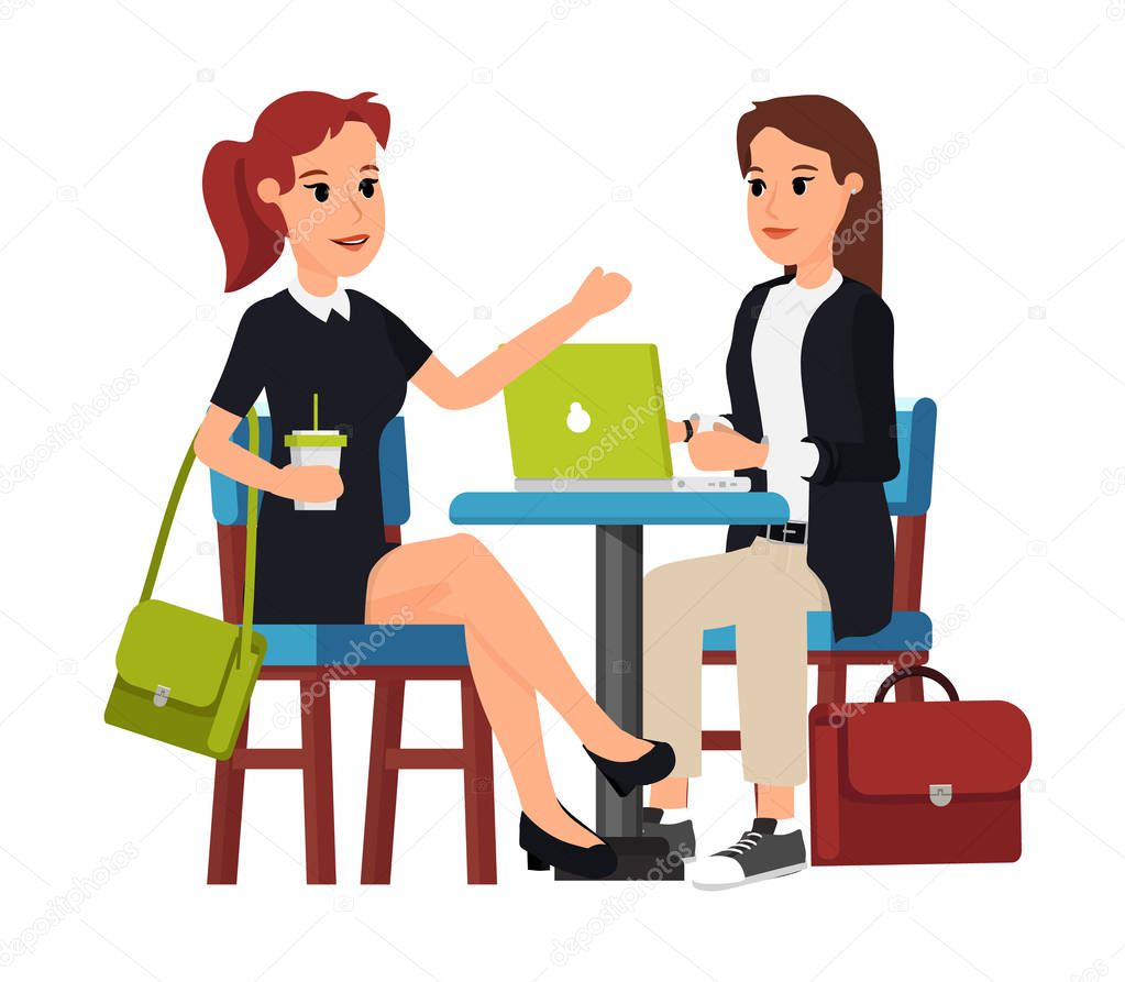 Two beautiful business women sitting