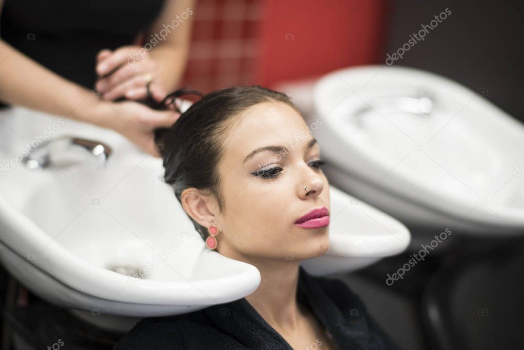 Washing hair in hair dressing saloon