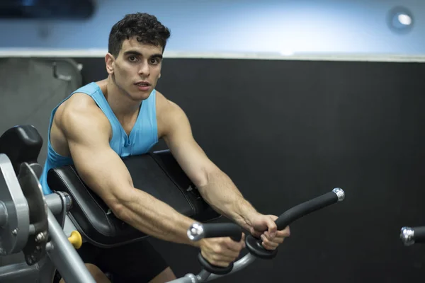 sporty young man training in gym