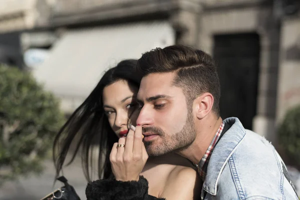 Smoking couple in city outdoors with sunset afternoon light