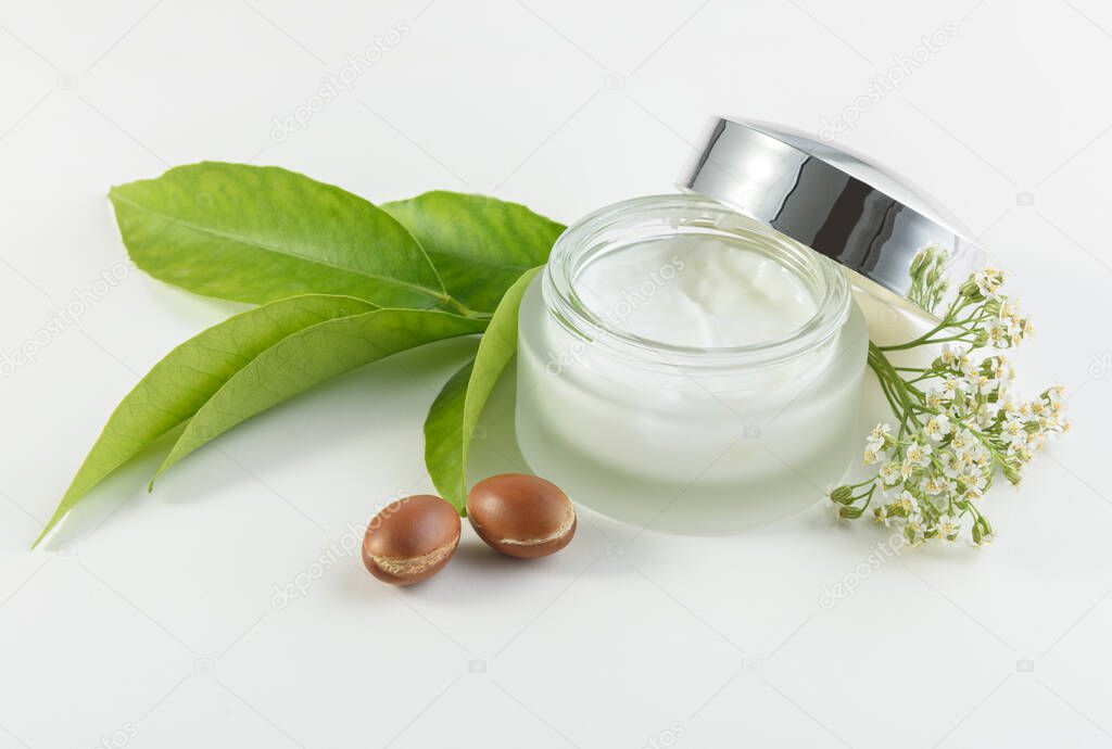 jar of cream for skincare with argan nuts