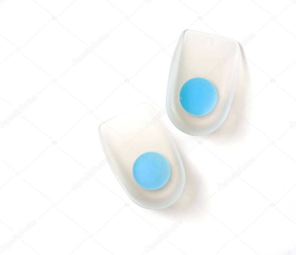 Orthopedic silicone heel from calluses for the correction of different leg lengths on a white background. Silicone insert in the forefoot. Medical insoles. Correction of flat feet.
