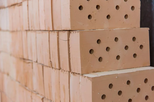 Ready bricks. Brick blocks at a brick factory. Warehouse with finished bricks