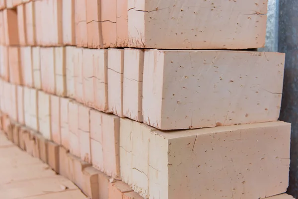 Ready bricks. Brick blocks at a brick factory. Warehouse with finished bricks