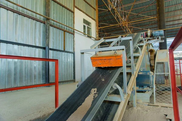 Conveyor at a brick factory. Conveyor belt for conveyors. Loading tape for the transportation of building materials
