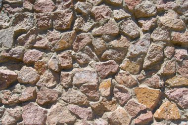 Doku kırmızı taşlar. Duvar kağıdı kırmızı granit. Duvar ile kırmızı çakıl kaplı olduğu. Taş ile beton dökülür. Dekoratif duvar döşeme taş. Kırmızı granit cephe. Taş blok duvar yapısı.
