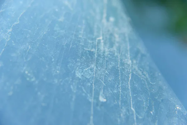 Texture dirty droplets on the glass. Clean and dirty glass. Drops of dust dried on the stained glass window. Sand and dust dripped onto the car window. Wallpaper dust rolled and dried on the glass.