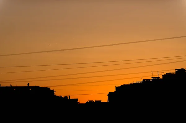 Orange Sunset City Roofs High Rise Buildings Electrical Cables Wires — Stock Photo, Image