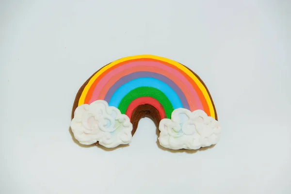 Gingerbread in the form of a rainbow. Confectionery. Sweet pastries. Cookies covered with icing. Cooking Gingerbread cookie on a white background. Gingerbread.