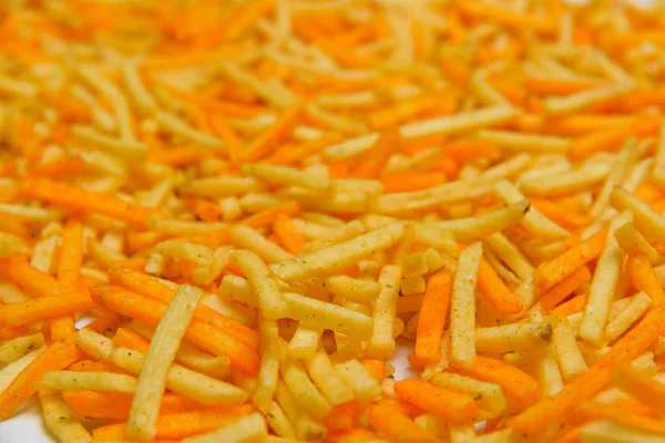 Gevrek patates yapışır. Cum. Patates kızartması doku. Patates cipsi. Tuzlu ve peynir kızartması. Fast food. Yukarıdan görüntüleyin. Ücretsiz yakın çekim.