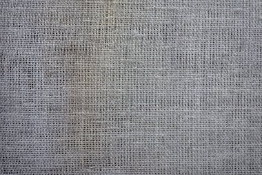 Yoğun kumaş bir ahşap yapı çivilenmiş. Malzeme. Gri kumaş dokusuna. Döşemelik Kumaş ahşap panoları. Demir çivi. Çit. Eskrim.