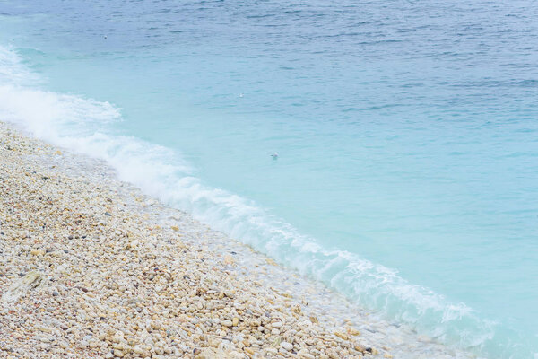 Rocky shore by the sea. Black Sea. Large boulders and boulders. The waves crash on the rocks. A spray of water. Rocky beach. Water surface. Waves. Rest in Crimea. Sevastopol. Journey. Tourism.