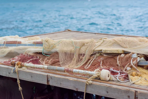 Embankment of Balaclava. Iron pier. Fishing nets. Fishing. Ropes Waves on the sea. Water surface. Yalta. Rest in Crimea. Walk along the beach. Tourism.