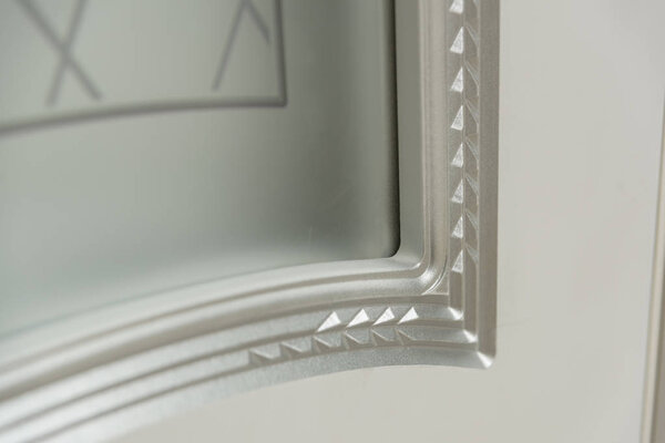 Door painted white. Wood carving. Metal door handle. Anti-burglar armored door. Metal interior doors. The design of the door. Interior.