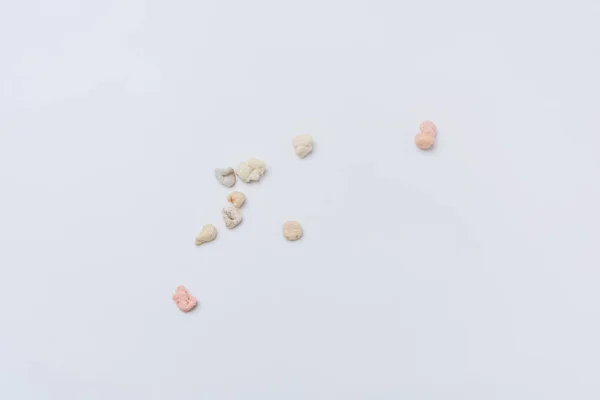 Colorful bubble gum on a white background. Gum. Culinary product. Chewing the cud. Used product. Chewing gum chewed. Already chewed. Inedible elastic base.