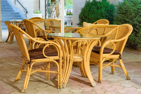 Wicker furniture. Summer terrace of the restaurant. Decor. Texture of wicker furniture. Weaving of vines. Garden furniture. Furniture made of natural material.