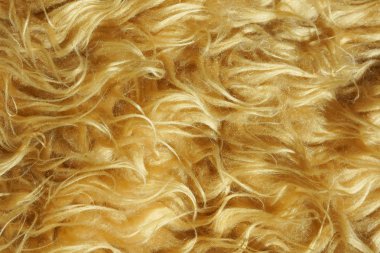 Kahverengi kısa kürk doku. Kahverengi soyut arka plan. Merinos cilt olarak sarı kahverengi yapay kürk.