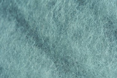 İplik için gri yün dokusu. Gri-yeşil soyut arka plan. Gri Yün, keçeleşme için.