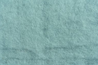 İplik için gri yün dokusu. Gri-yeşil soyut arka plan. Gri Yün, keçeleşme için.