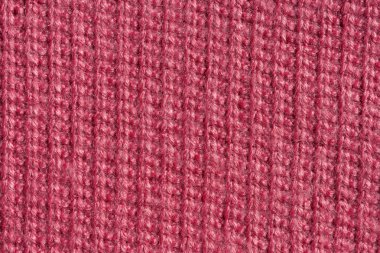 Örme pembe kumaş dokusu. Pembe soyut arka plan. Açık pembe kalın kış kumaş