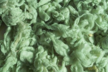 İplik için açık yeşil yün dokusu. Yeşil soyut arka plan. Örgü için renkli yün.