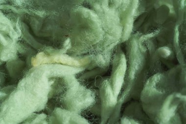 İplik için açık yeşil yün dokusu. Yeşil soyut arka plan. Örgü için renkli yün.