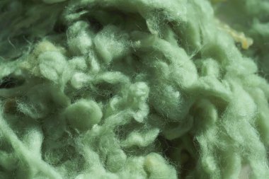 İplik için açık yeşil yün dokusu. Yeşil soyut arka plan. Örgü için renkli yün.