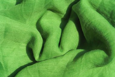 Açık yeşil kumaş dokusu. Açık yeşil soyut arka plan. Yeşil kumaş closeup.
