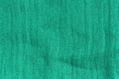 Deniz yeşili kumaş dokusu. Zümrüt soyut arka plan. Yeşil kumaş closeup.