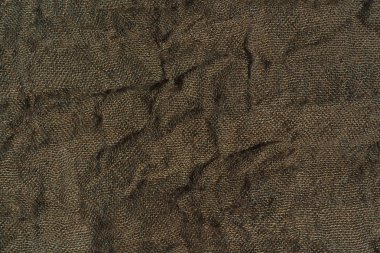 Kumaş renkleri haki dokusu. Koyu yeşil soyut arka plan. Yeşil kumaş closeup.