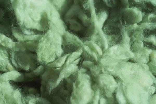 İplik için açık yeşil yün dokusu. Yeşil soyut arka plan. Örgü için renkli yün.