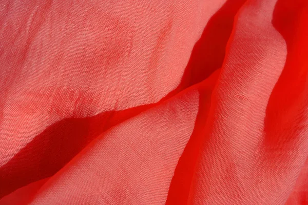 Texture of pink fabric. Pink abstract background. Light pink fabric closeup.