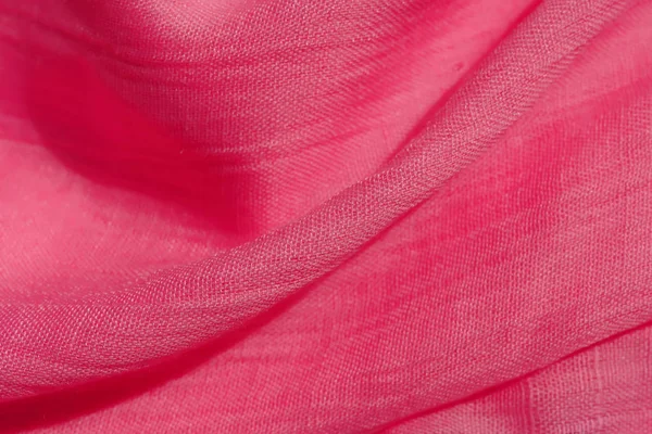 Texture of pink fabric. Pink abstract background. Light pink fabric closeup.