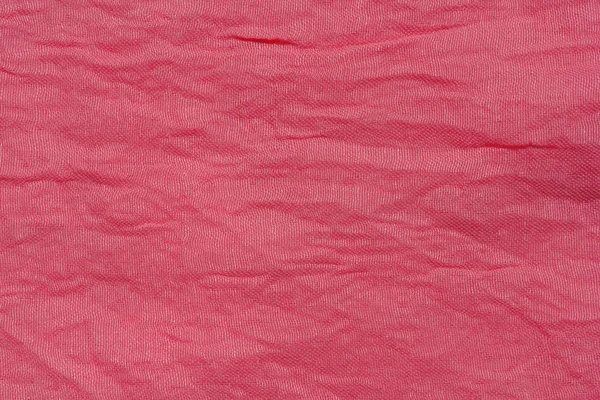 Texture of pink fabric. Pink abstract background. Light pink fabric closeup.