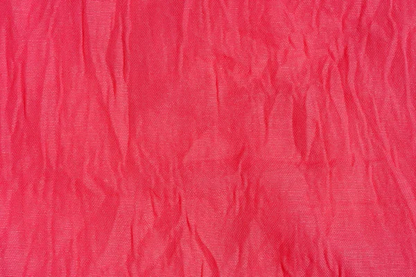 Texture of pink fabric. Pink abstract background. Light pink fabric closeup.