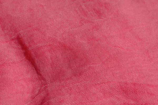Texture of pink fabric. Pink abstract background. Light pink fabric closeup.