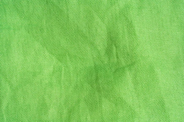 Texture of light green fabric. Light green abstract background. Green fabric closeup.
