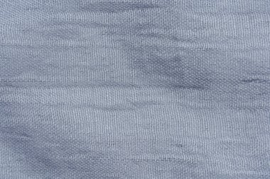 Açık gri kumaş dokusu. Gri soyut arka plan. Koyu gri kumaş closeup.