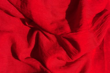 Kırmızı kumaş dokusu. Kırmızı atkı yakın. Kadın kırmızı çaldı.