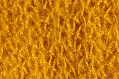 Sarı renk örme kumaş doku. Parlak sarı soyut arka plan. Kumaş hardal rengi.