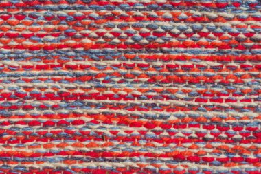 Renkli pamuklu kumaş dokusu. Tekstilin kabartma yüzeyi. Bitki kökenli lif. Yumuşak doku.