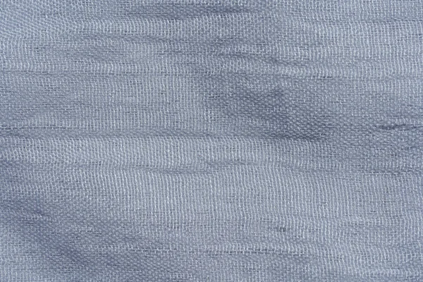 Texture of light gray fabric. Gray abstract background. Dark gray fabric closeup.