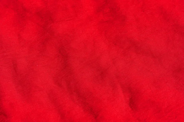 Texture of red fabric. Red scarf close up. Female red stole.